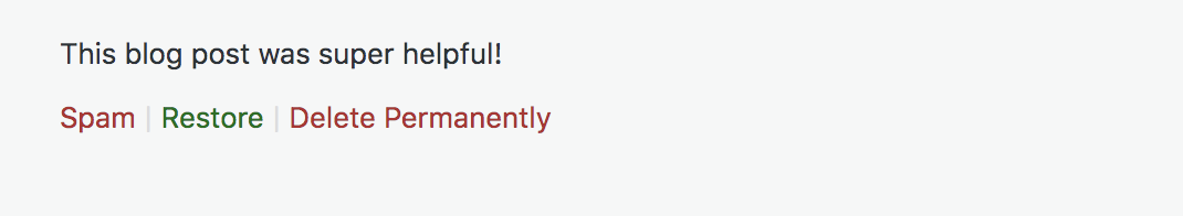 options to mark a comment as spam or restore it